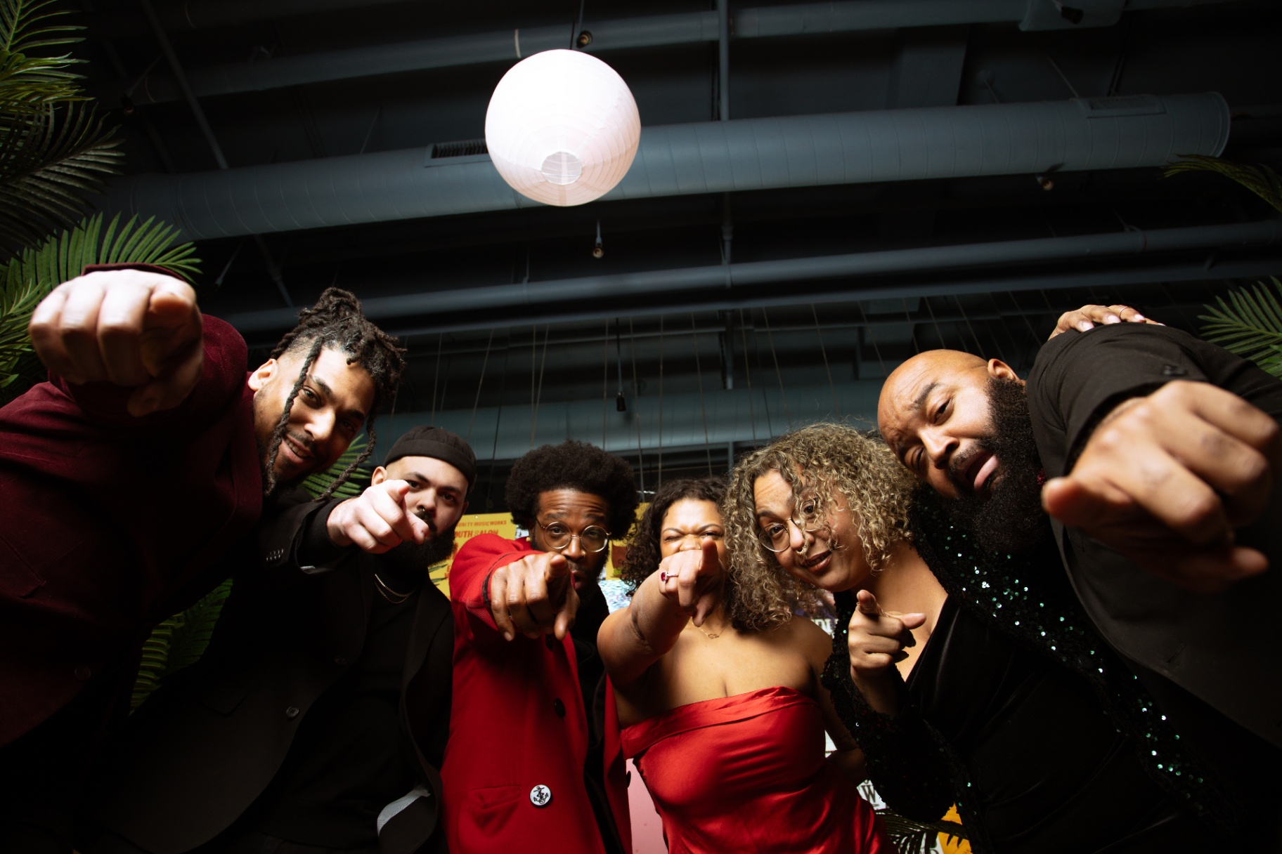 The Park Band leaning into the lens in a playful group portrait