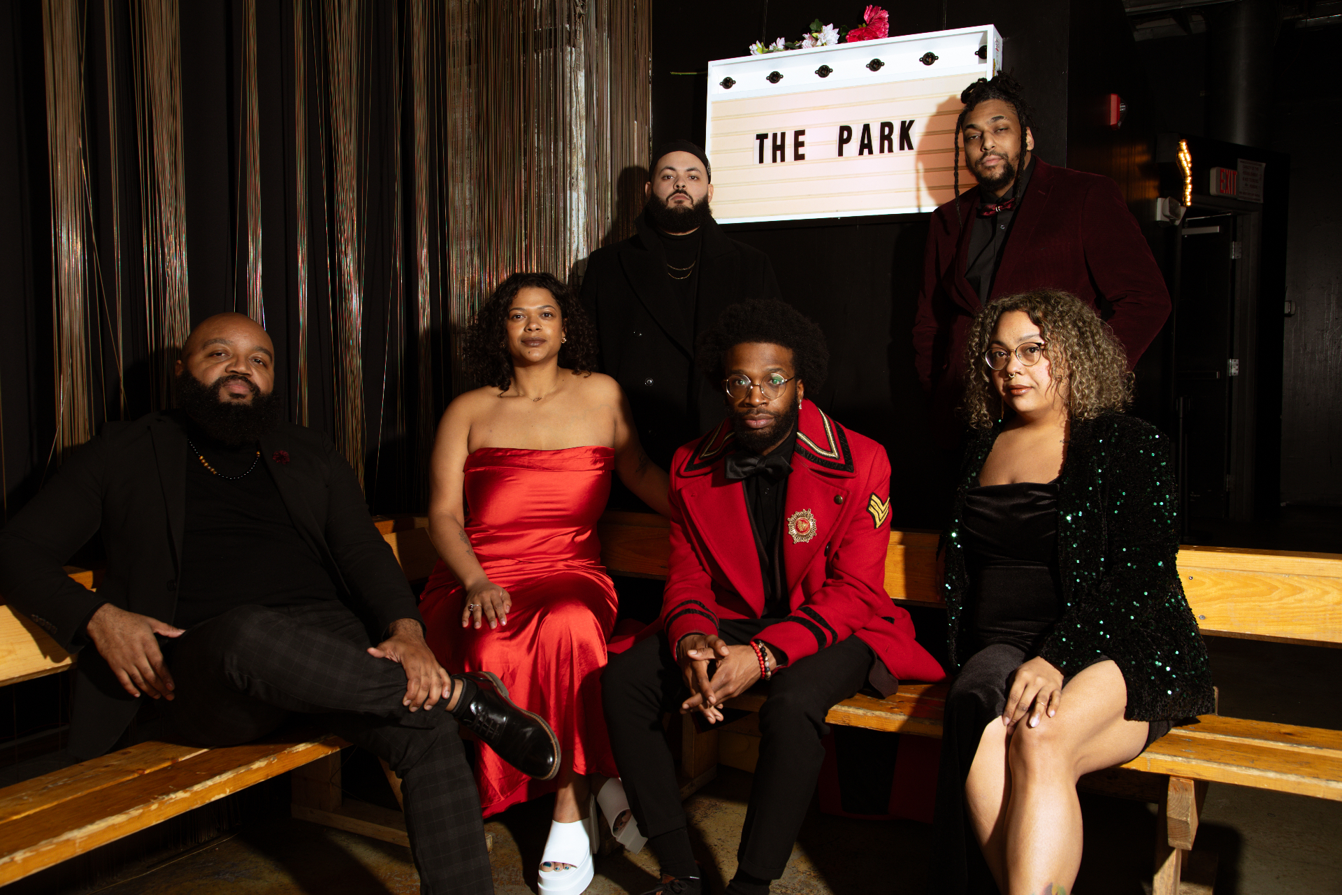 The Park Band portrait beneath The Park sign