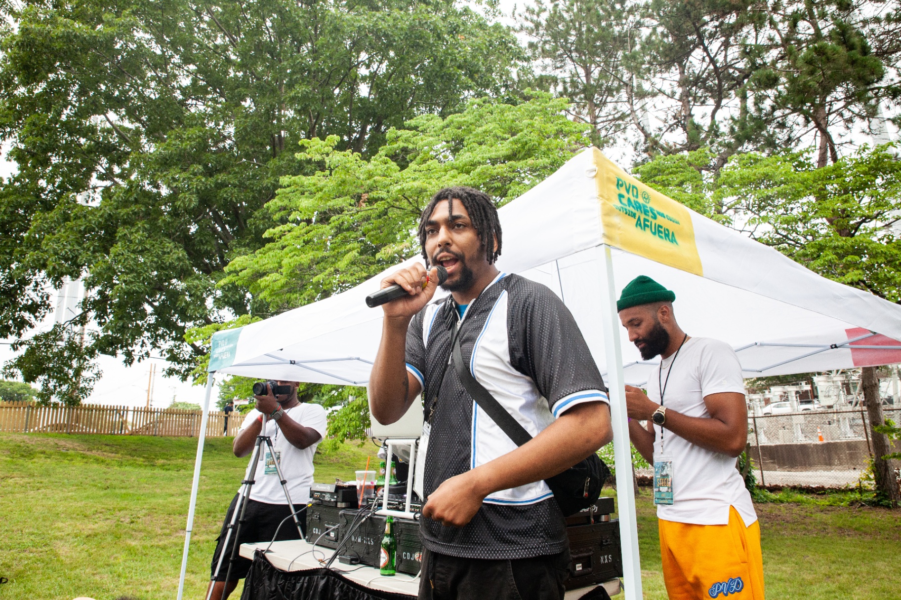 Host on the mic under the PVD Cares tent at Steez 2021