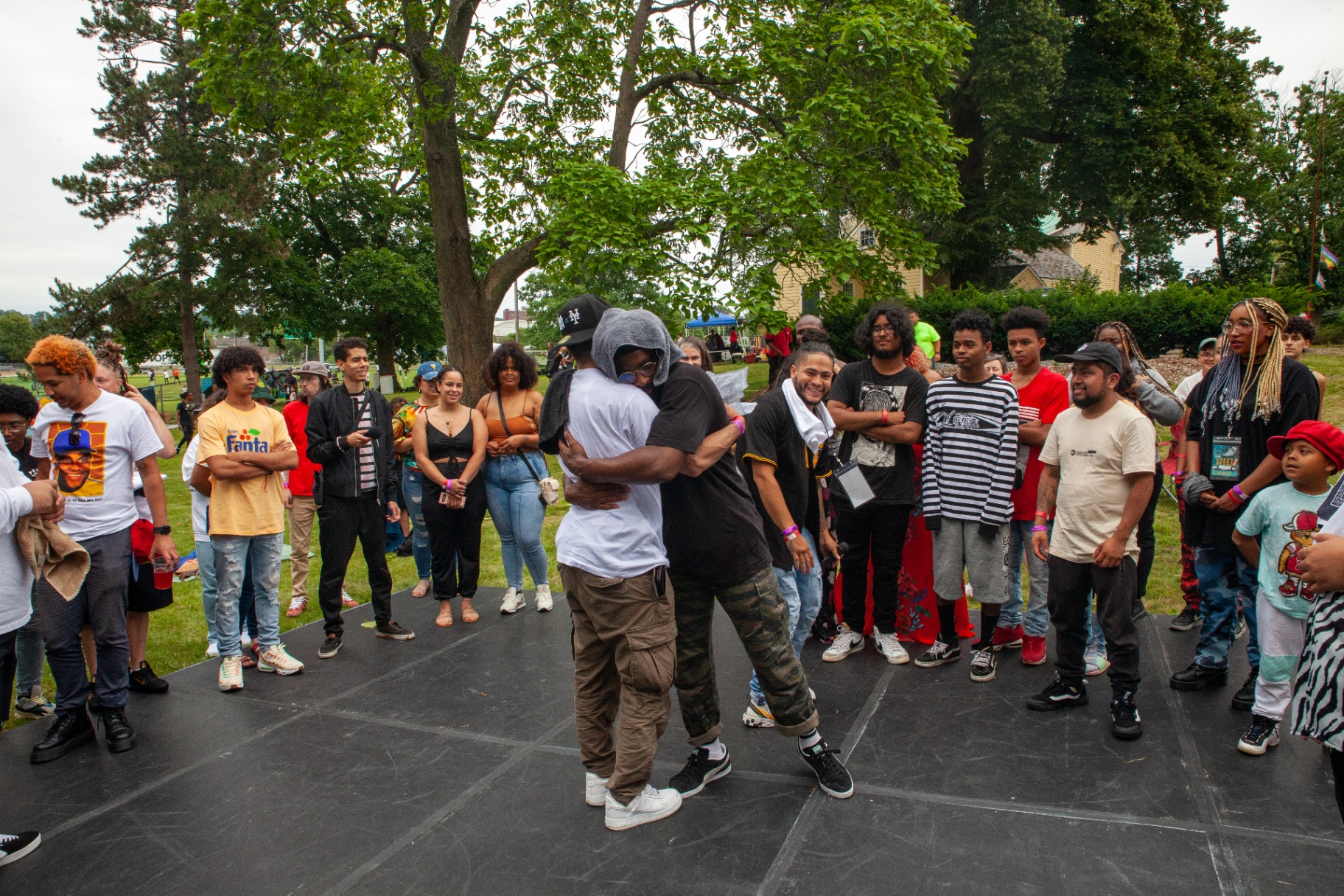 Two dancers embracing in the circle after a Steez 2021 battle